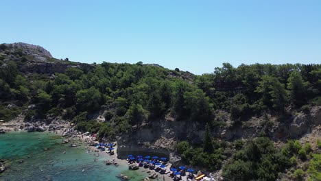 Anthony-Quinn-Bay-in-Faliraki,-Rhodes-in-Greece-during-the-day-with-crystal-clear-water