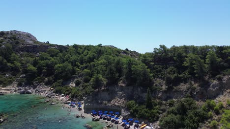 anthony quinn bay in faliraki, rhodes in greece during the day with crystal clear water