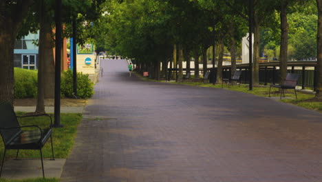 Red-Brick-Pedestrian-Road-Along-White-River-State-Park-In-Indianapolis,-Indiana,-USA