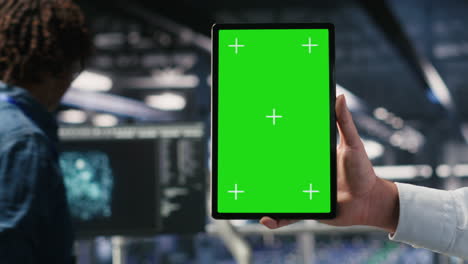 close up of data center admin using mockup tablet to update software