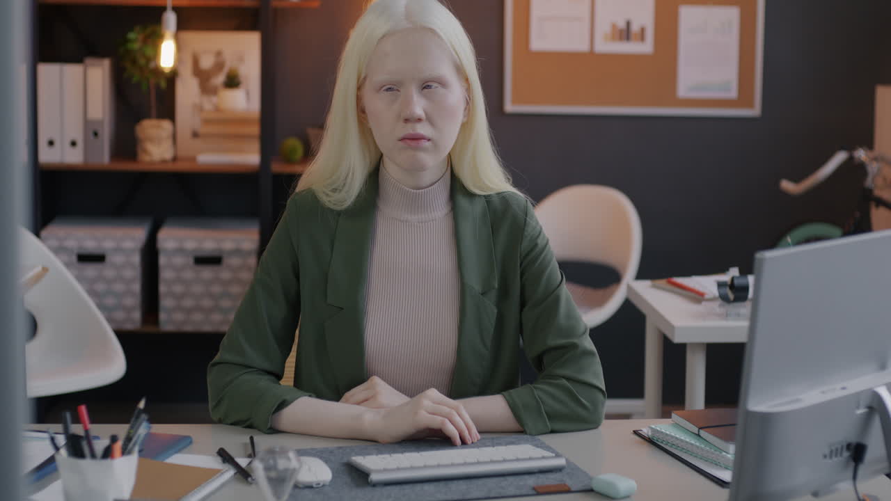 Woman sitting at her desk in an office