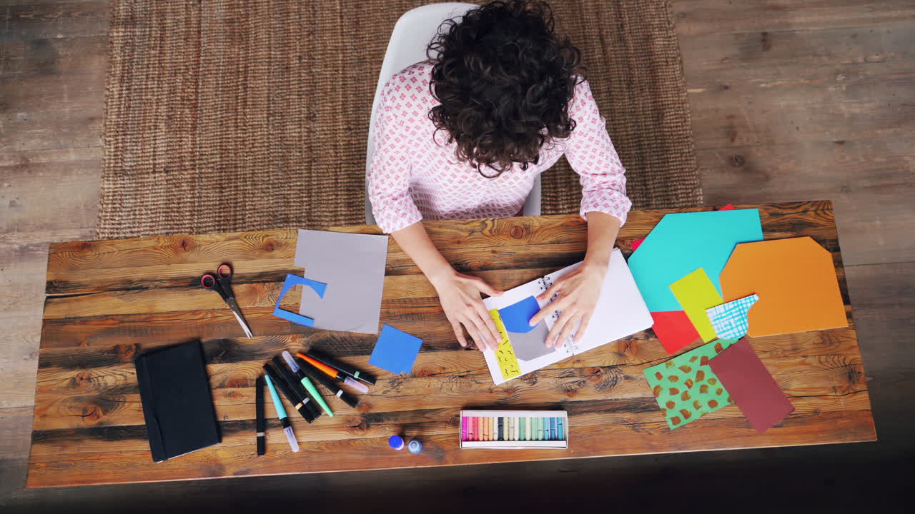 Woman Creating Paper Crafts at Wooden Desk