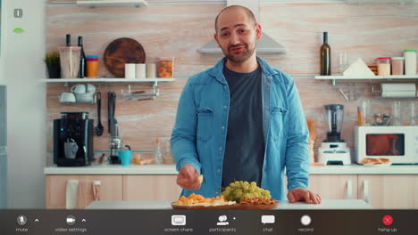 Man-talking-during-video-call-in-the-kitchen