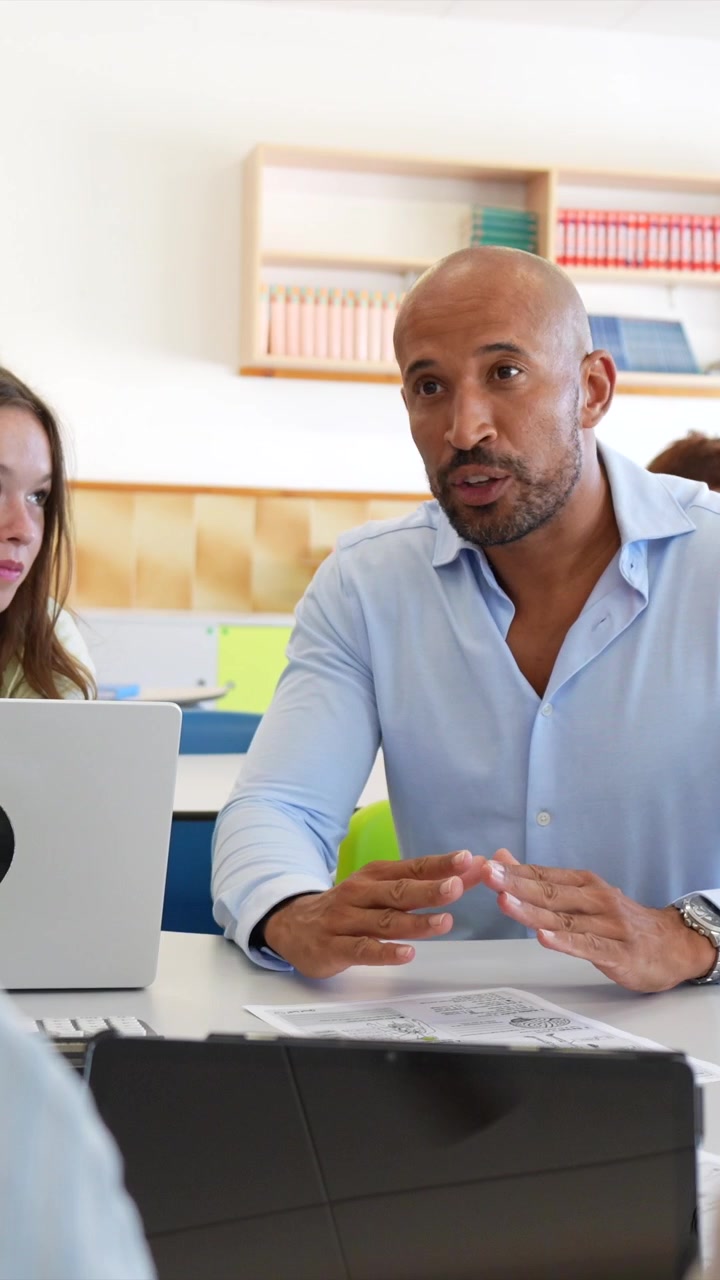 Professional Man Leading a Meeting in a Modern Office