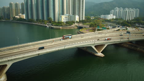 aerial hyper lapse of hong kong city chinese with skyscrapers cityscape modern building smart city, cars crossing bridge