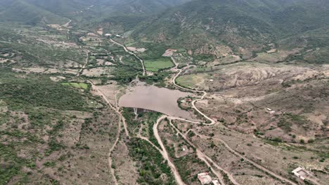 aerial view of a serene valley with a lake