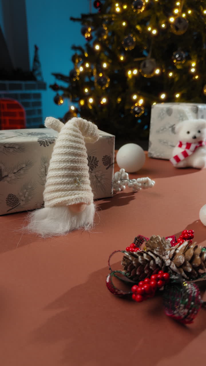 Christmas puppet and gift boxes on a children's table