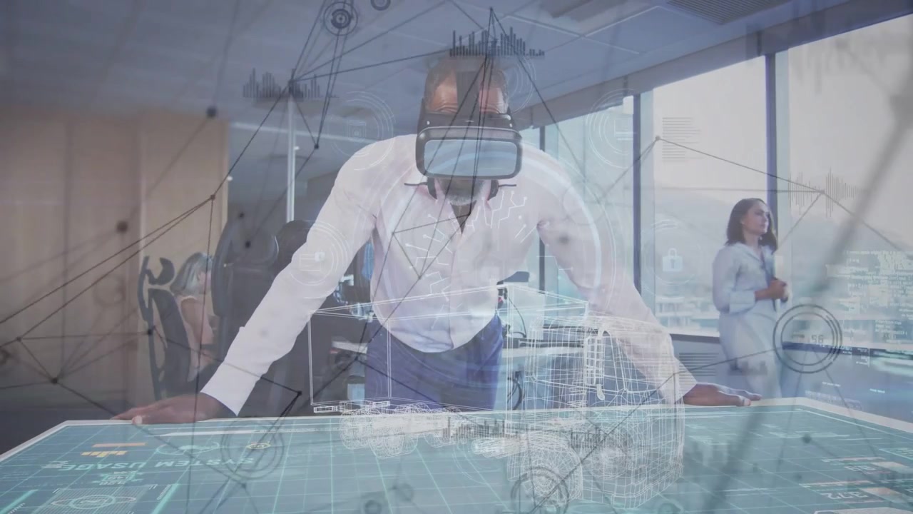 Diverse team watching mature African American man leaning over holo table with VR headset in office