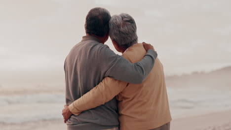 beach hug, back and senior couple