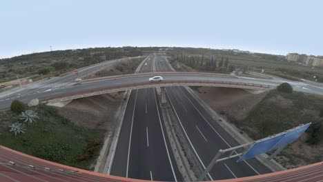 wide view of a highway crossroad junction, timelapse