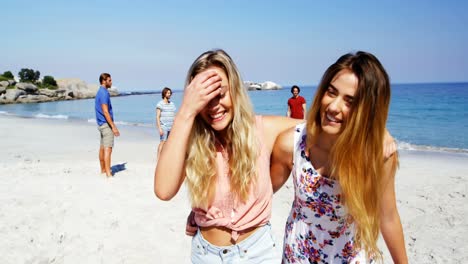 Friends-enjoying-together-at-beach