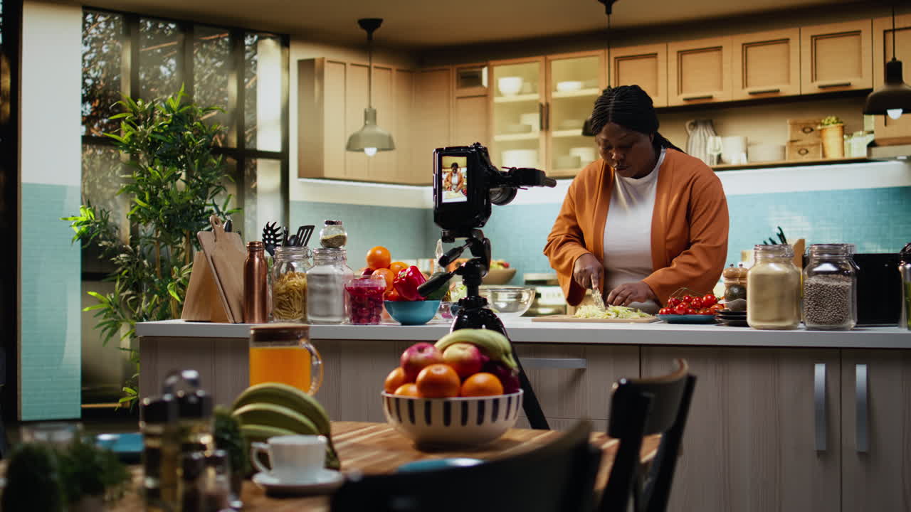 Woman influencer chef recording a food vlog and cutting iceberg salad
