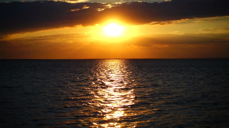 Sunset over the sea. Slow motion. Shooting at the sea