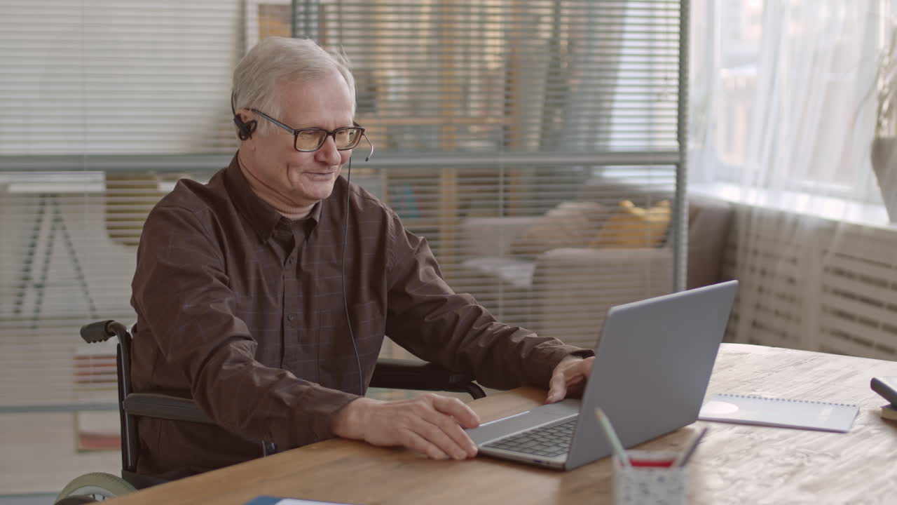 Senior Office Worker Having Video Conference
