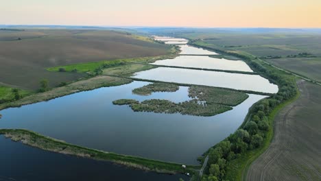 aerial view of fish hetching pond with blue water in aquacultural area