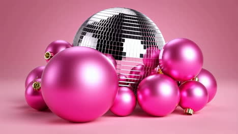 pink ornaments and disco ball on pink background