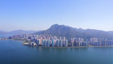 beautifully colored high apartments with fantastic views of ma on shan with the high mountains of the vast nature in the background