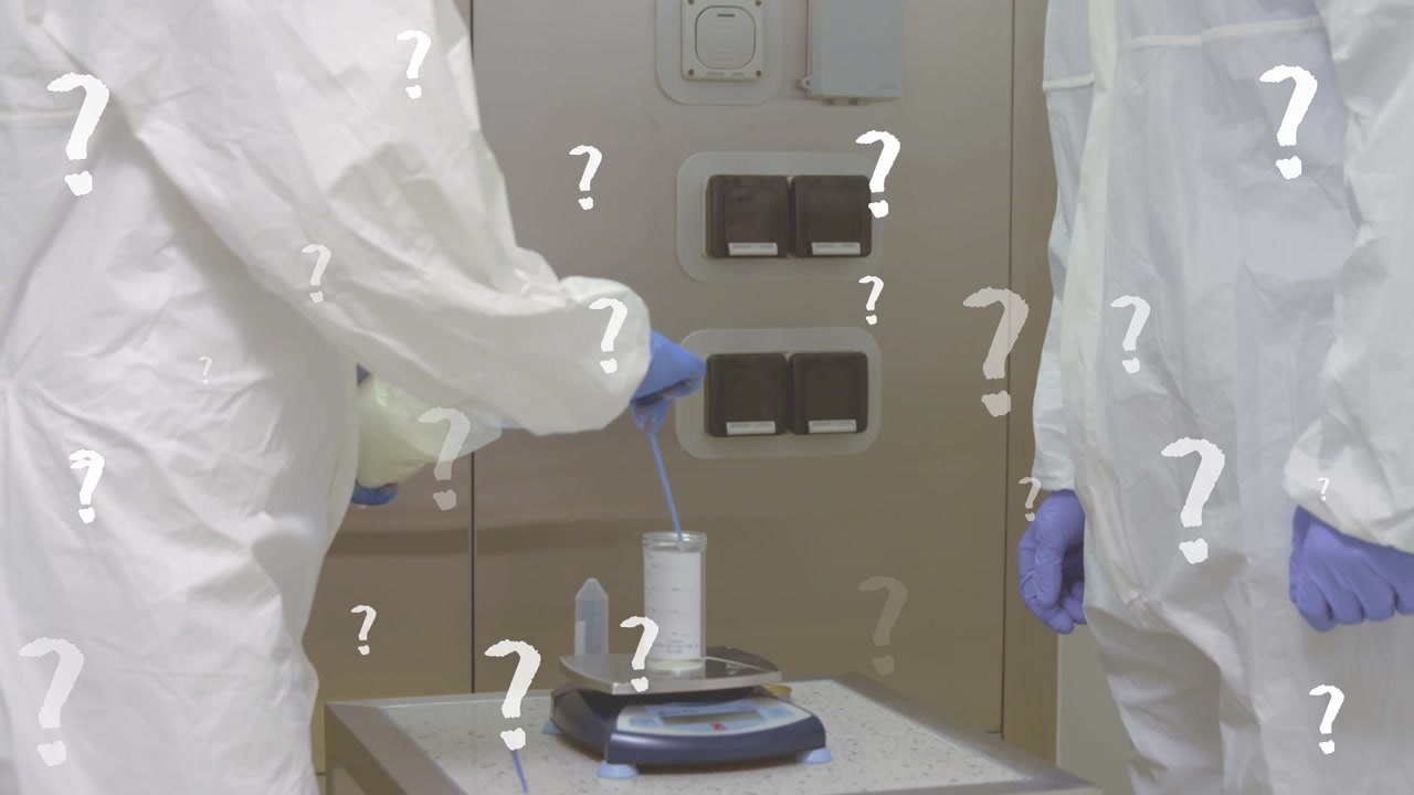 Animation of question marks over midsection of caucasian lab workers in safety clothes