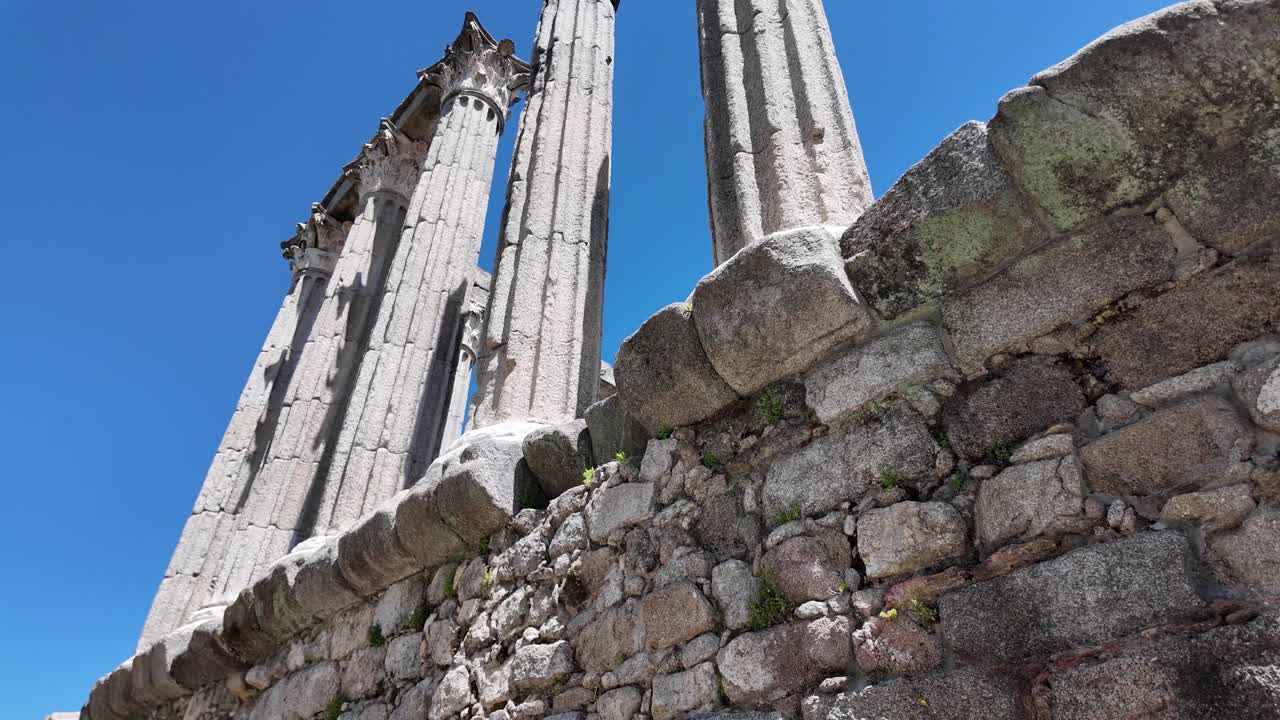 Ruins of Roman temple under blue sky in Évora Portugal