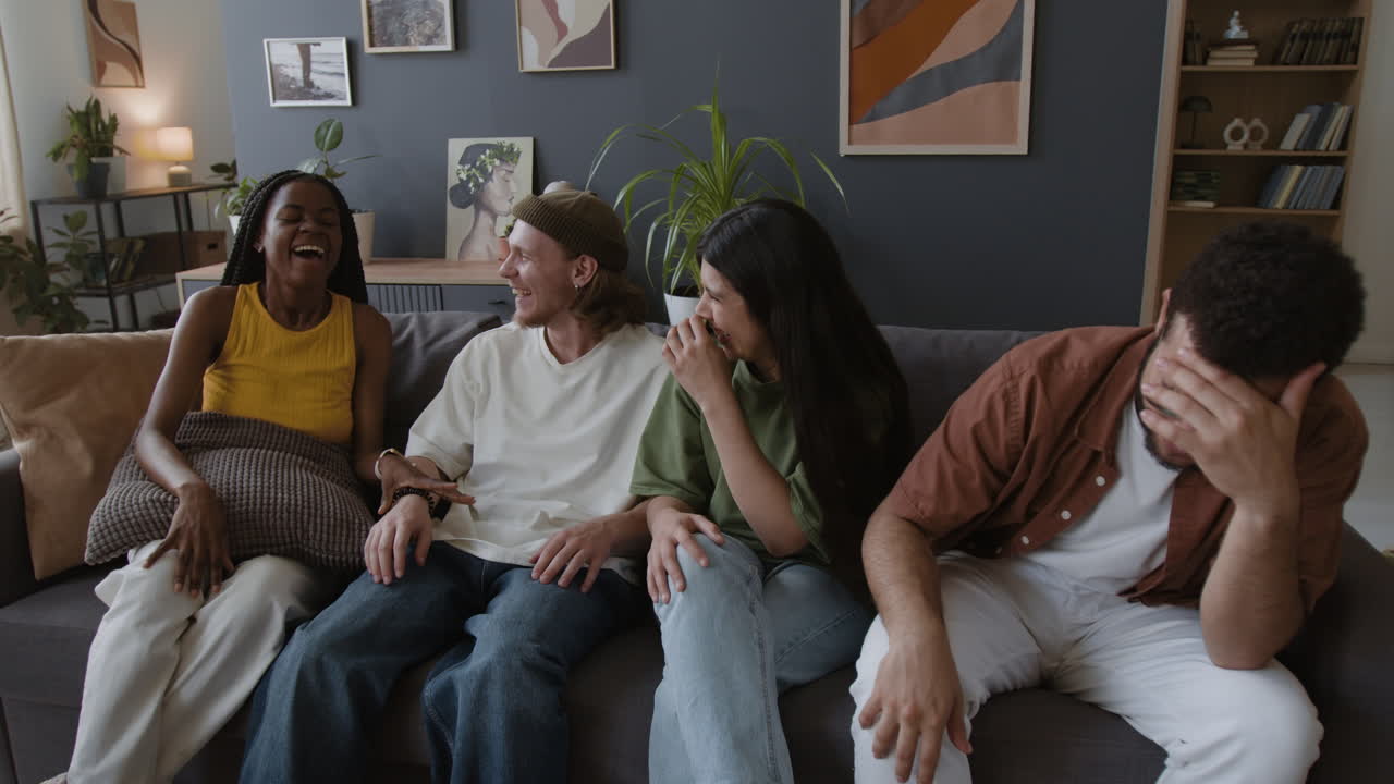 Friends laughing together on a couch