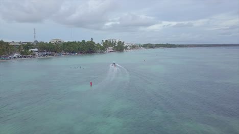 aerial over tourists riding a banana boat in the boca chica beach district in the dominican republic