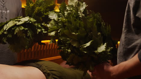 sauna treatment with oak branches