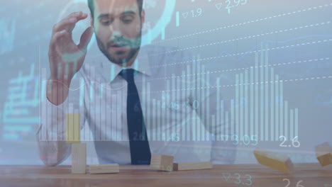 animation of graphs and trading board, caucasian businessman playing with wooden blocks