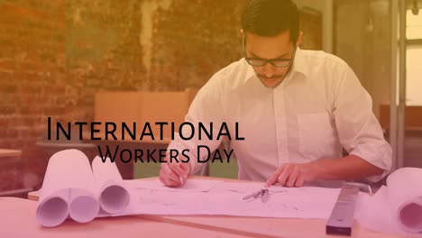 animation of international workers day over caucasian male engineer