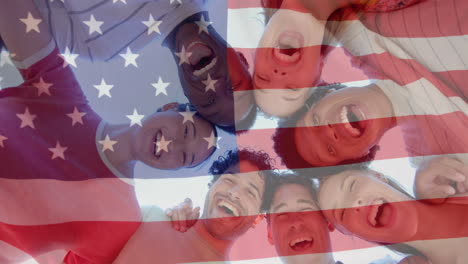 Animation-of-flag-of-usa-over-happy-diverse-friends-on-beach-in-summer