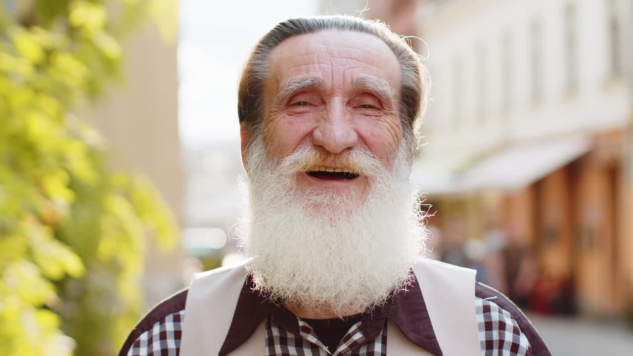 Happy elderly man smiling looking away dreaming resting good news feel satisfied in city street