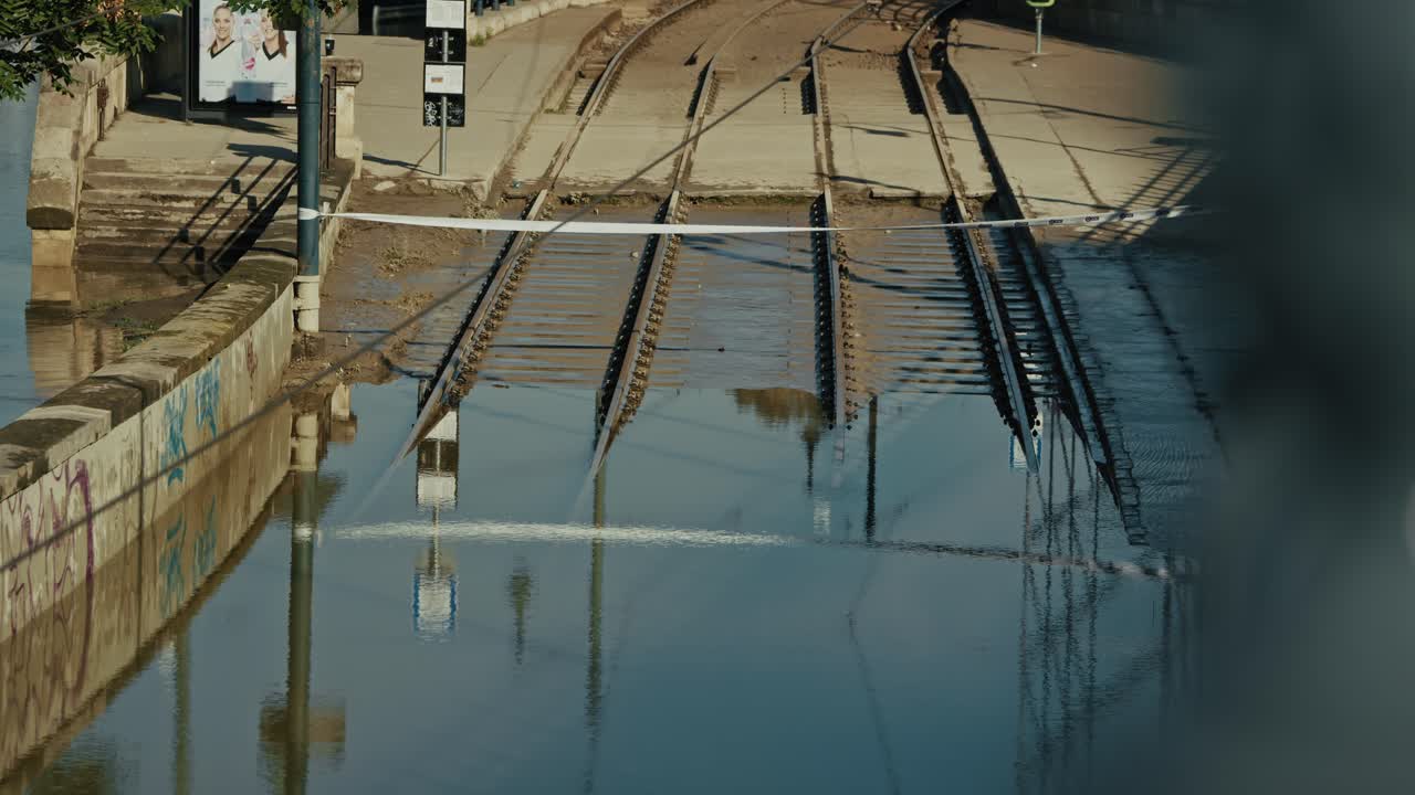 Flooded tram tracks in Budapest after the 2024 flood, with streets submerged in water
