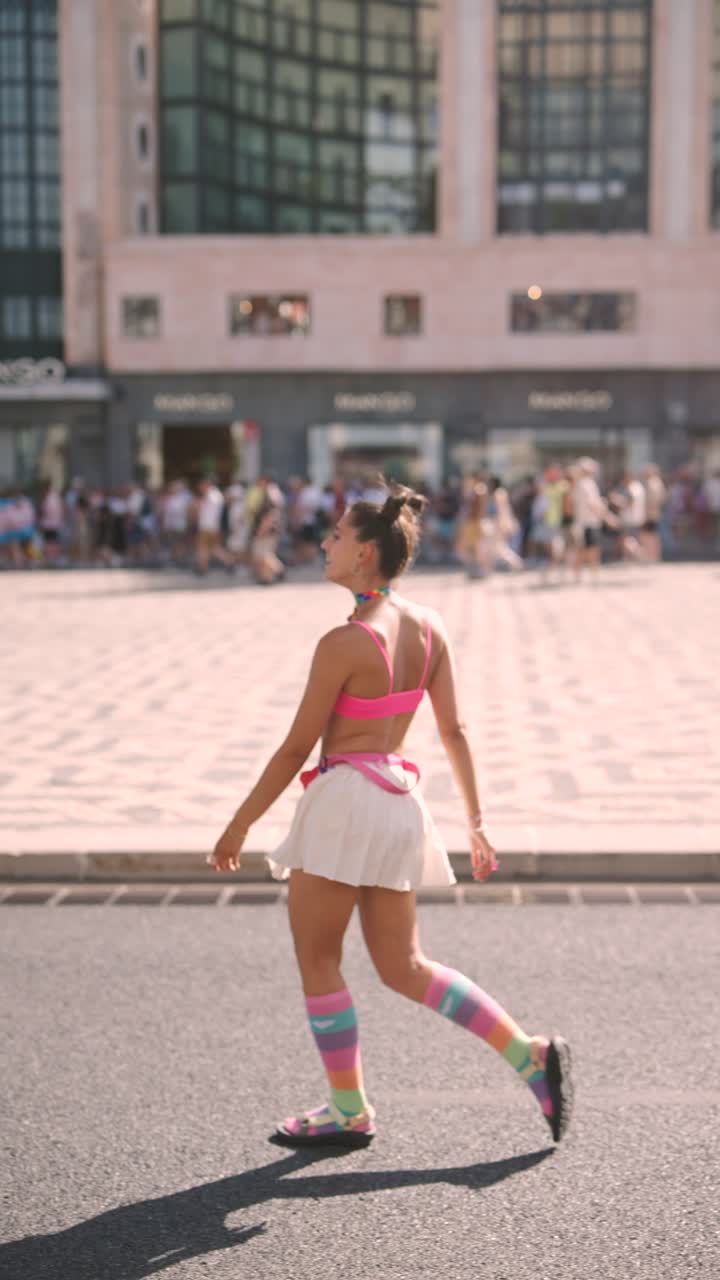 Woman in Pink Outfit at Pride Parade