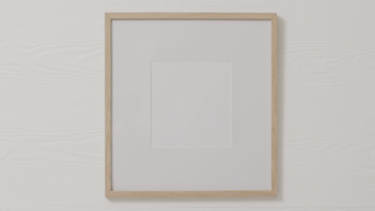 Wooden frame with copy space against white wall