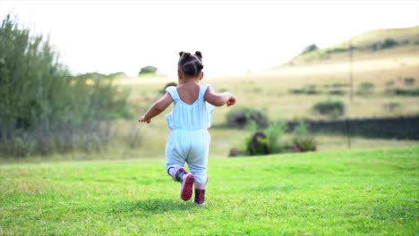 Two-year-old-South-African-girl-running-away-from-camera