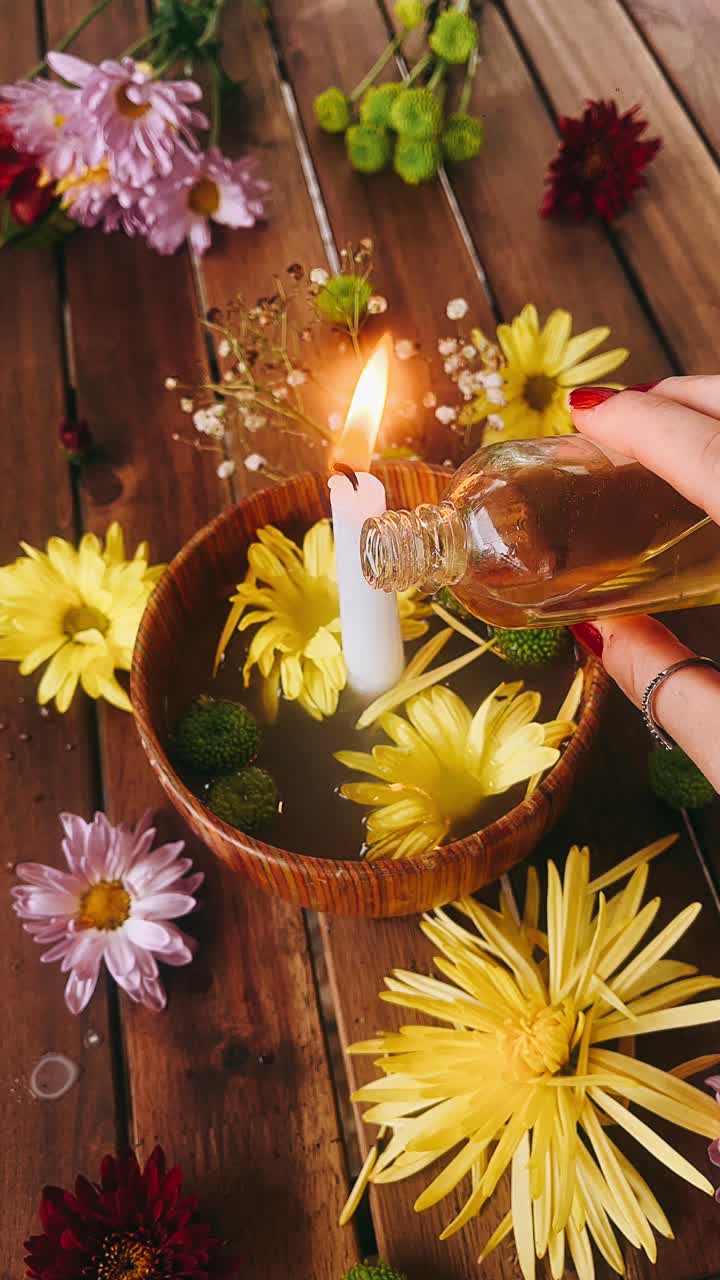Lysritual med blomster og olie