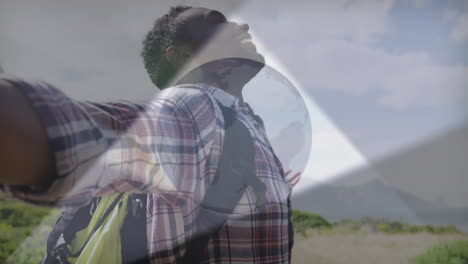 male hiker stretching arms in grassy meadow with backpack, showing health with animated data icons