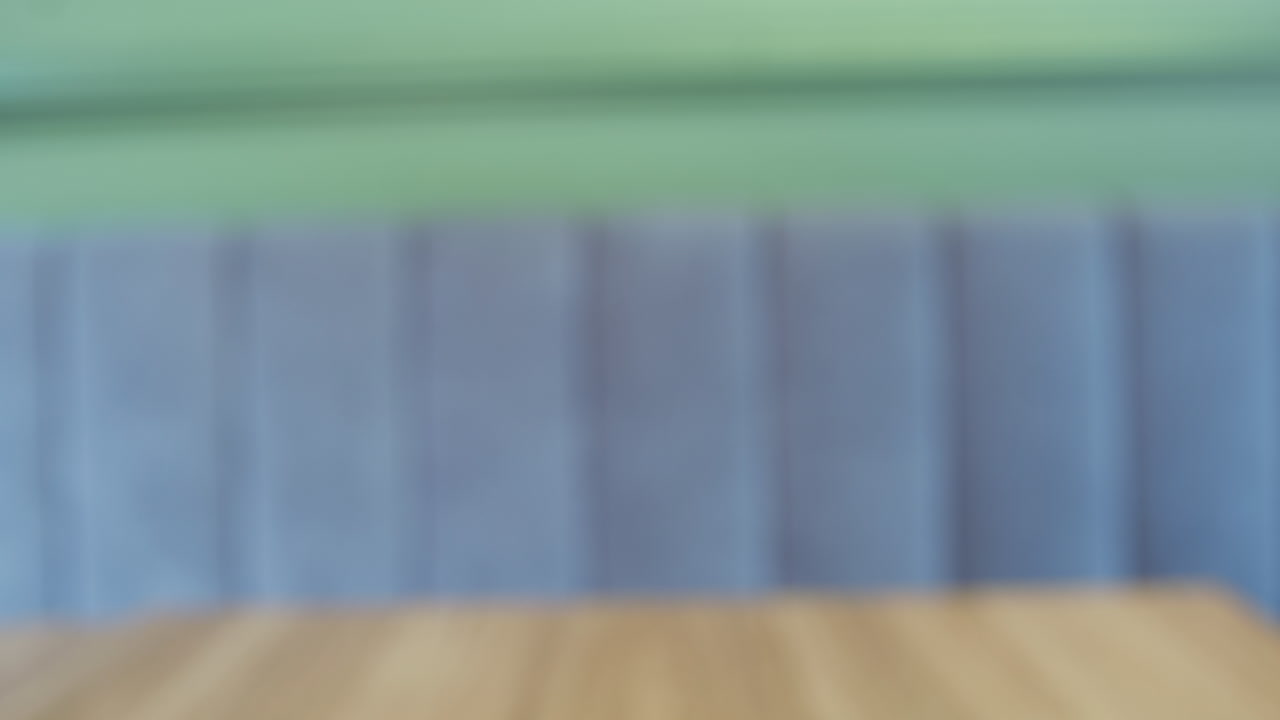 Close-up of a gourmet sandwich with layers of ham, cheese and vegetables, served appetizingly in a culinary setting