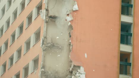 view of a concrete blocks and materials dropping down during a demolition of high rise skyscraper