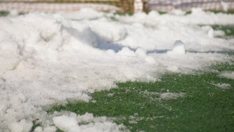 removing snow from a sports field