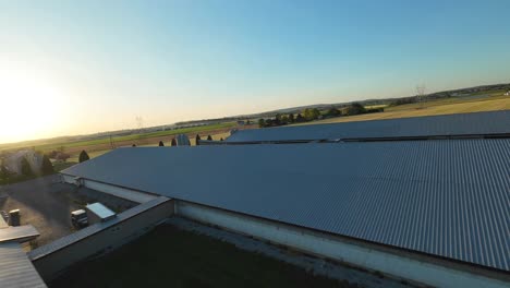 farm house with large barns in american suburb town
