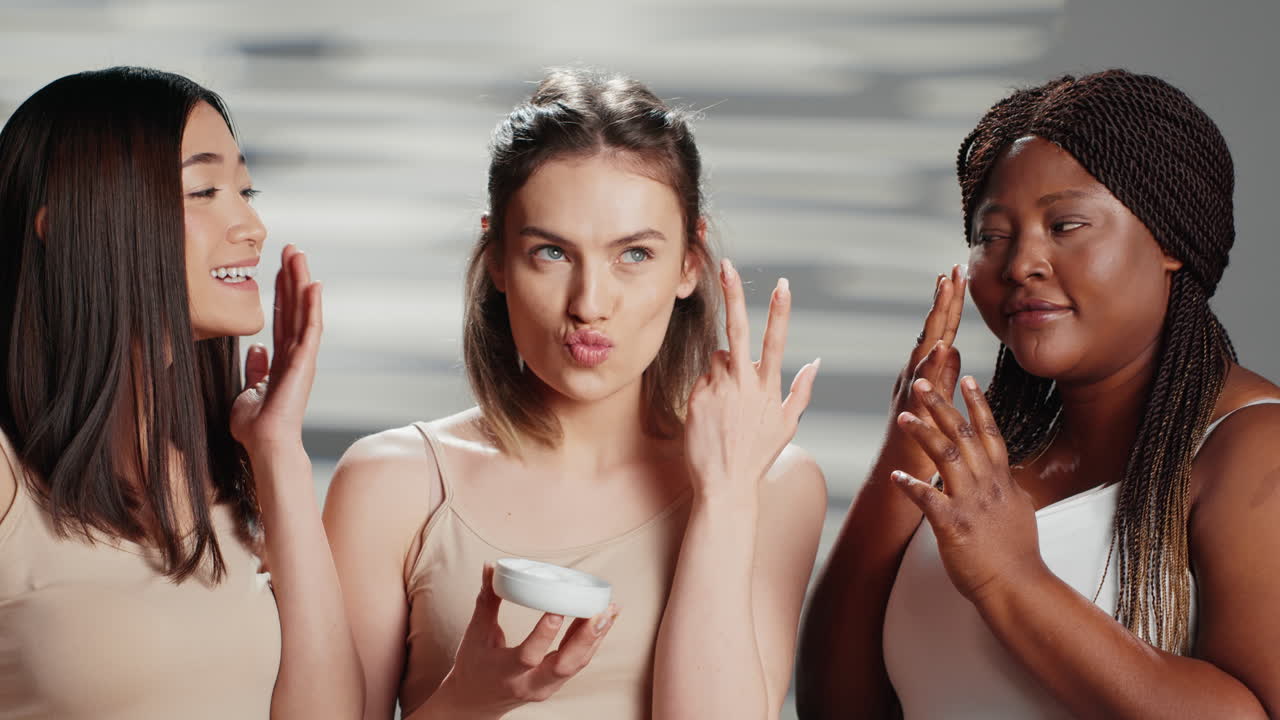 Diverse Group of Women Applying Skincare Cream