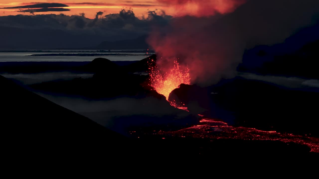 Lava ejecting from Litli-Hr&uacute;tur volcano eruption during sunset in Iceland