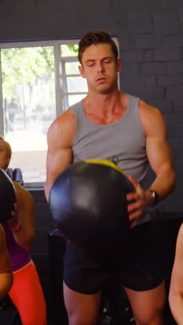 group of people exercising with ball