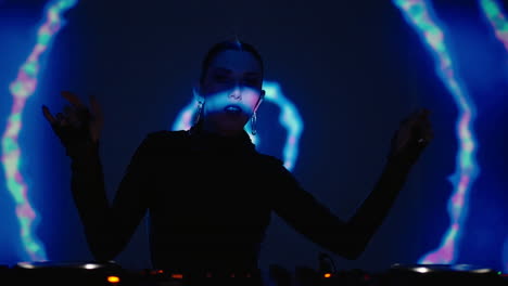 female dj performing at a nightclub