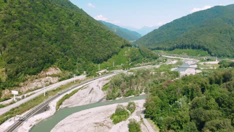 mountainous valley with highway and river