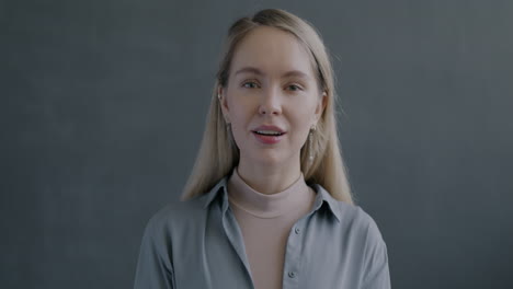 woman smiling and showing okay sign