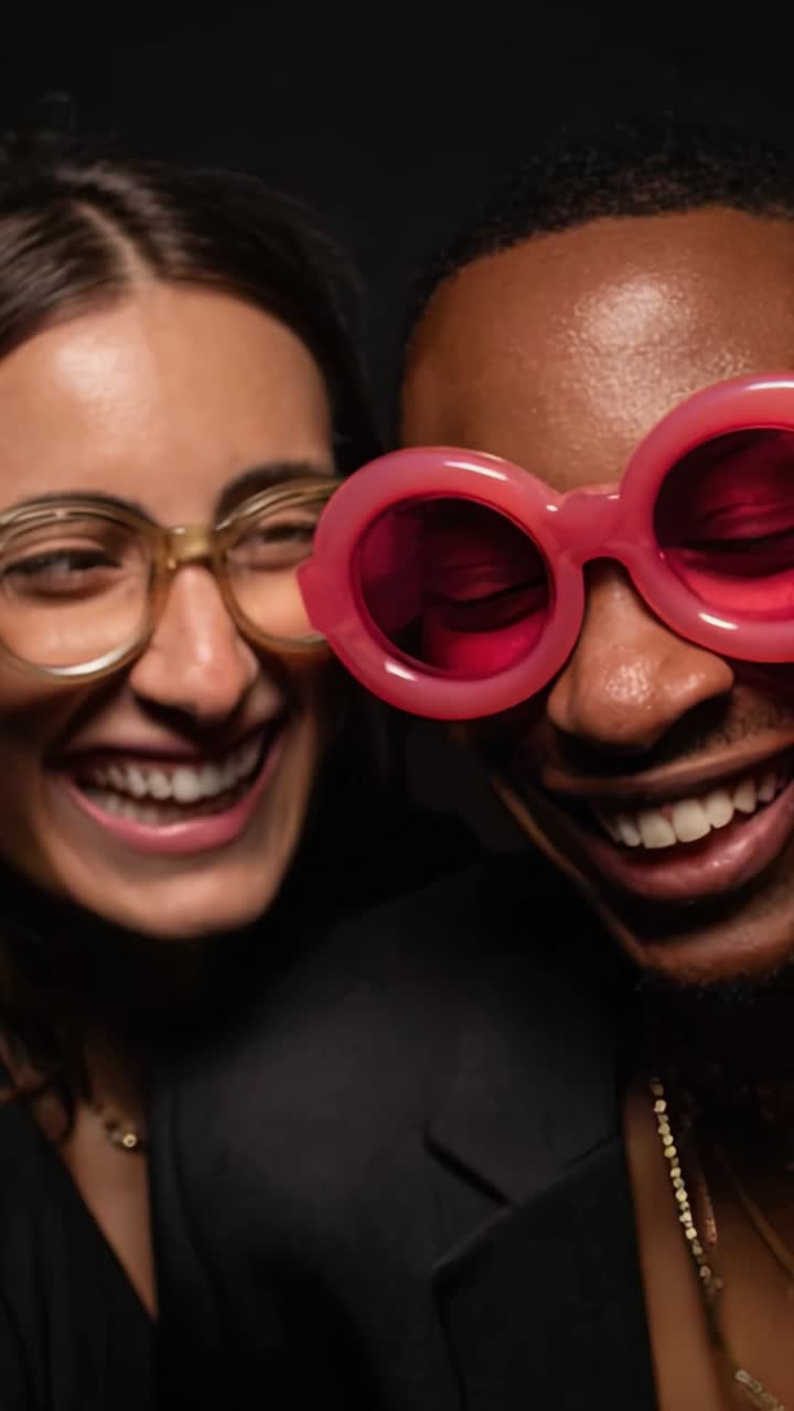 Joyful Friendship Captured in Vibrant Fashionable Eyewear with Smiling Faces Against a Dark Background That Radiates Happiness and Connection