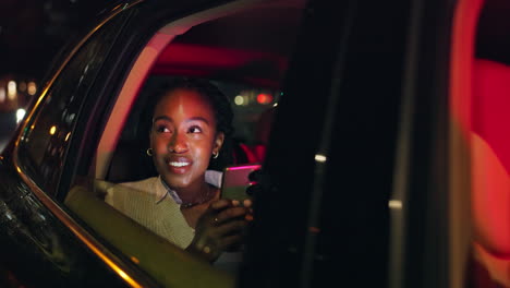 woman riding in a car at night