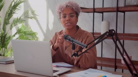 young african american woman blogger recording video podcast on business topics