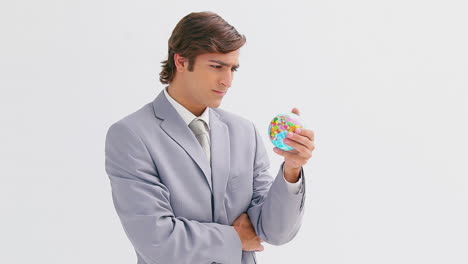 Businessman-holding-a-small-globe